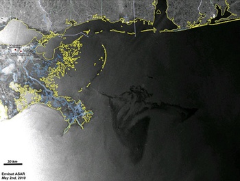 In this radar image, acquired from Envisat's Advanced Synthetic Aperture Radar (ASAR) on 2 May 2010 03:45 UTC (Saturday night local time), the oil spill is visible due east of the Delta National Wildlife Refuge extending into the Gulf of Mexico. The white dots are oil rigs and ships. Radar is especially suited for detecting oil spills. ESA